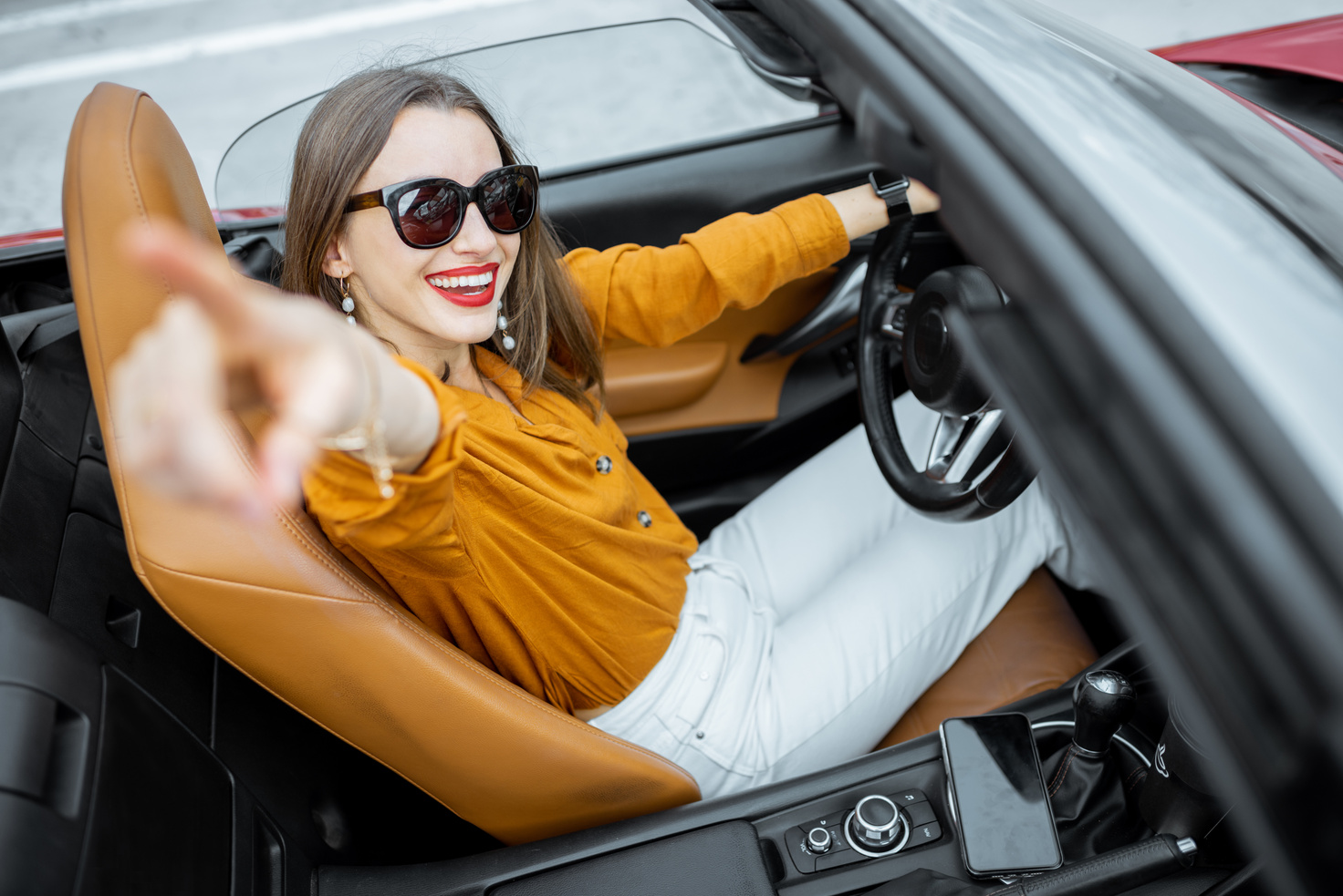 Happy Woman Driving a Car